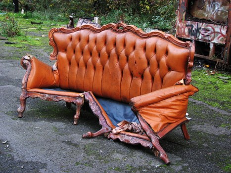 Front view of a commercial waste vehicle in service area