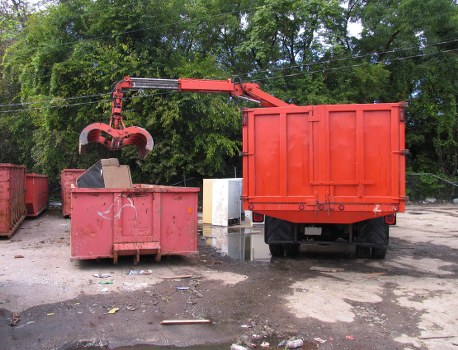 Team loading commercial waste into a Luton van during a Thamesmead office clearance
